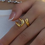 Gold curve ring