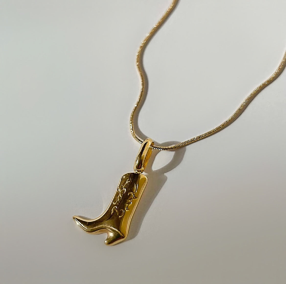 Gold cowboy boot necklace