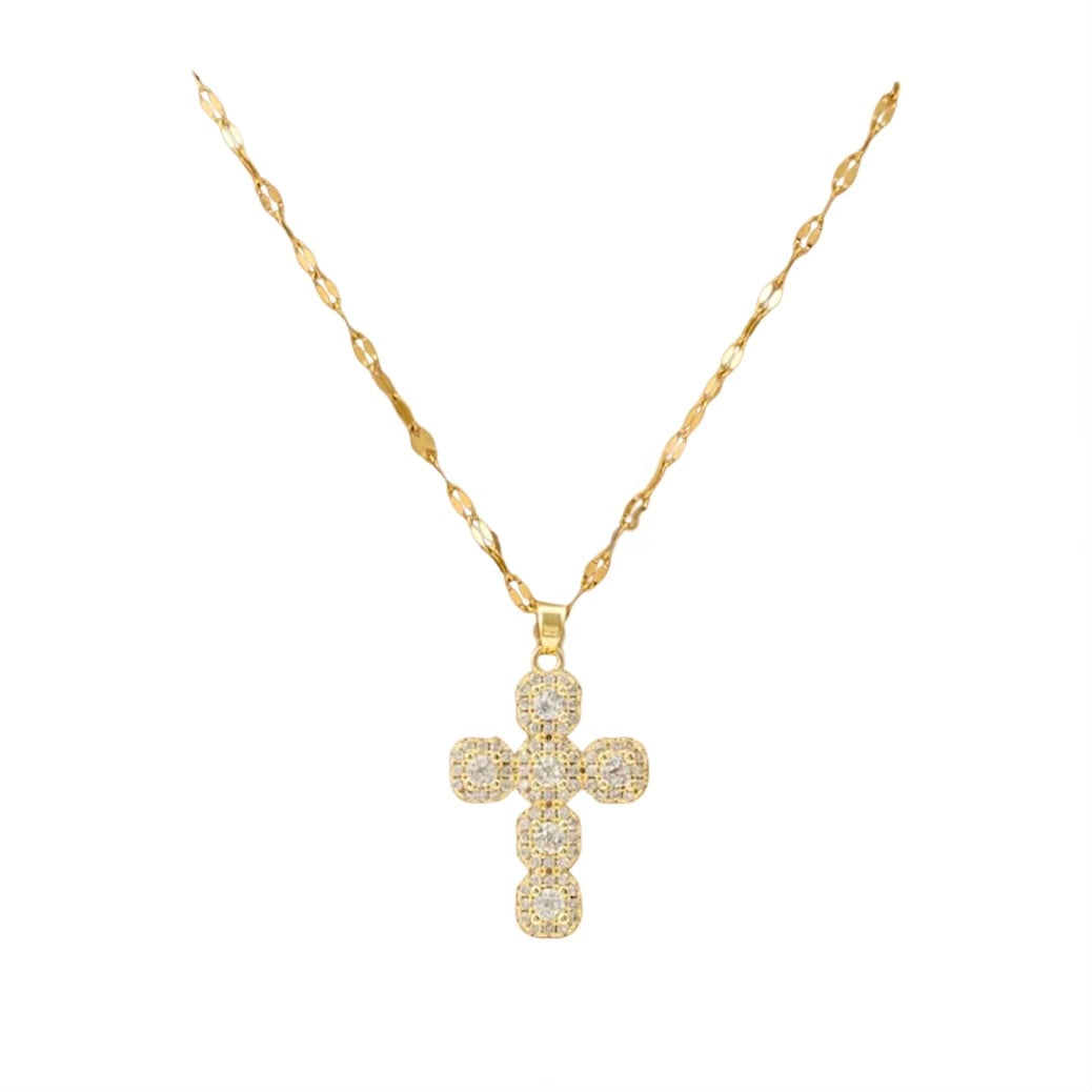 Gold cross necklace with diamonds on a white background
