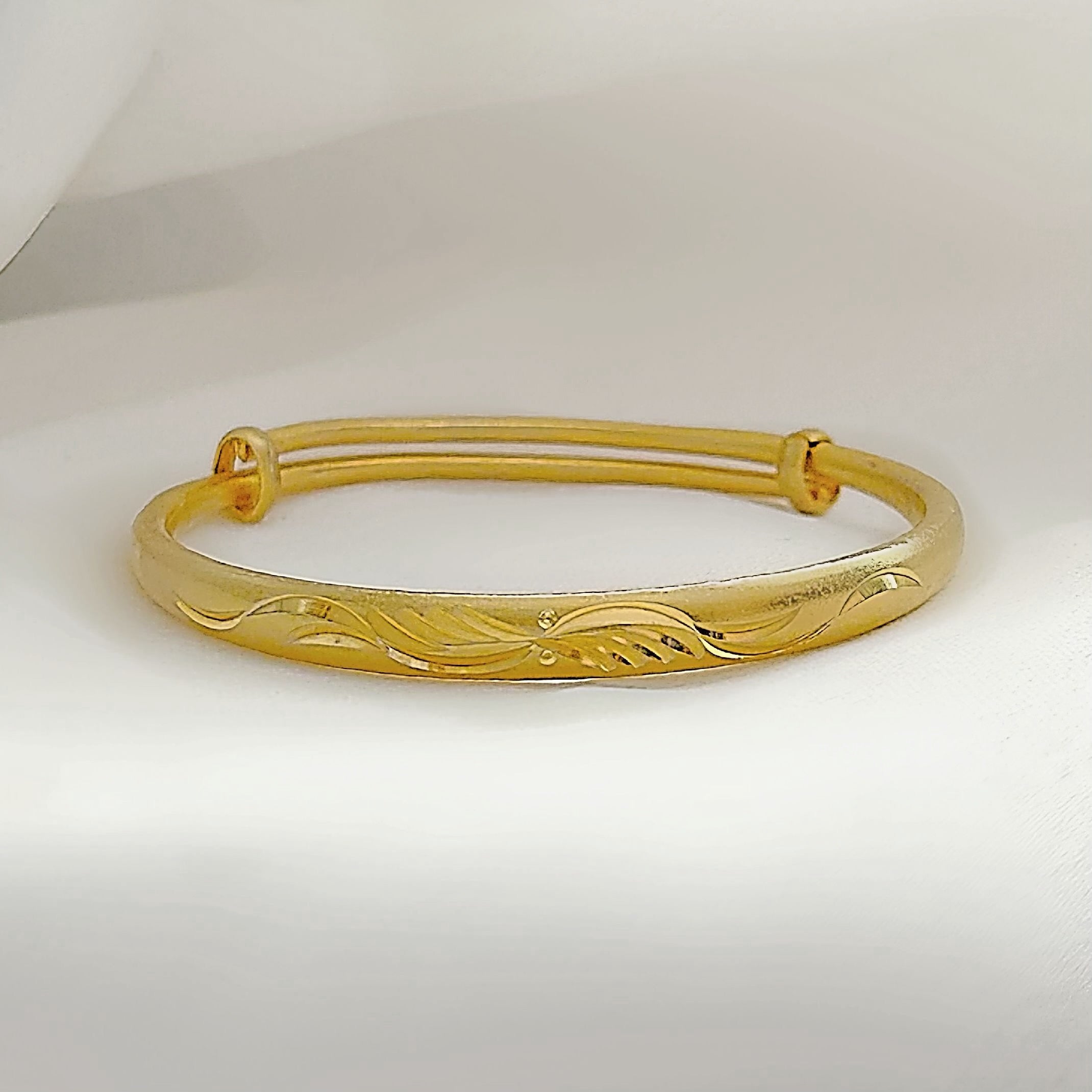 Gold angel wing bangle