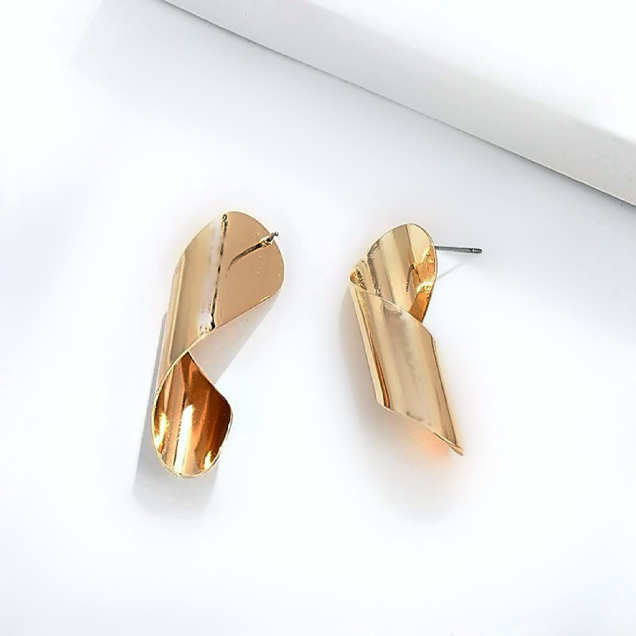 Gold twirl earrings 