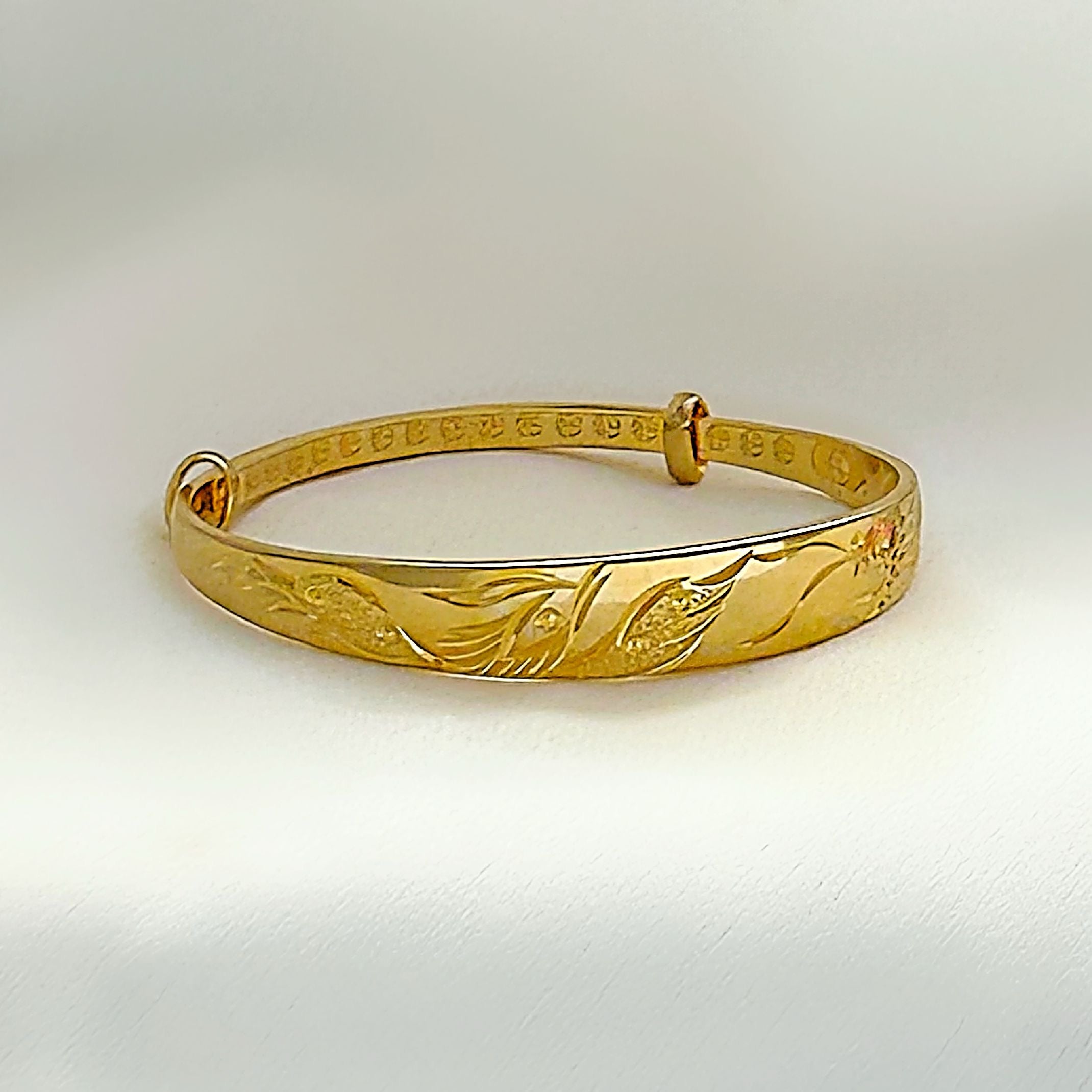 Gold bird bangle