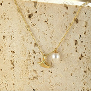 Gold mermaid tail necklace
