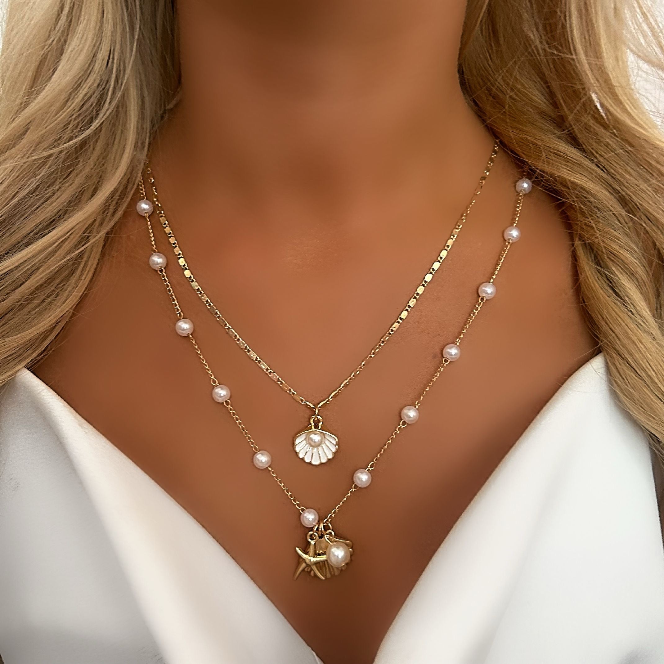 Gold shell and pearl necklaces 