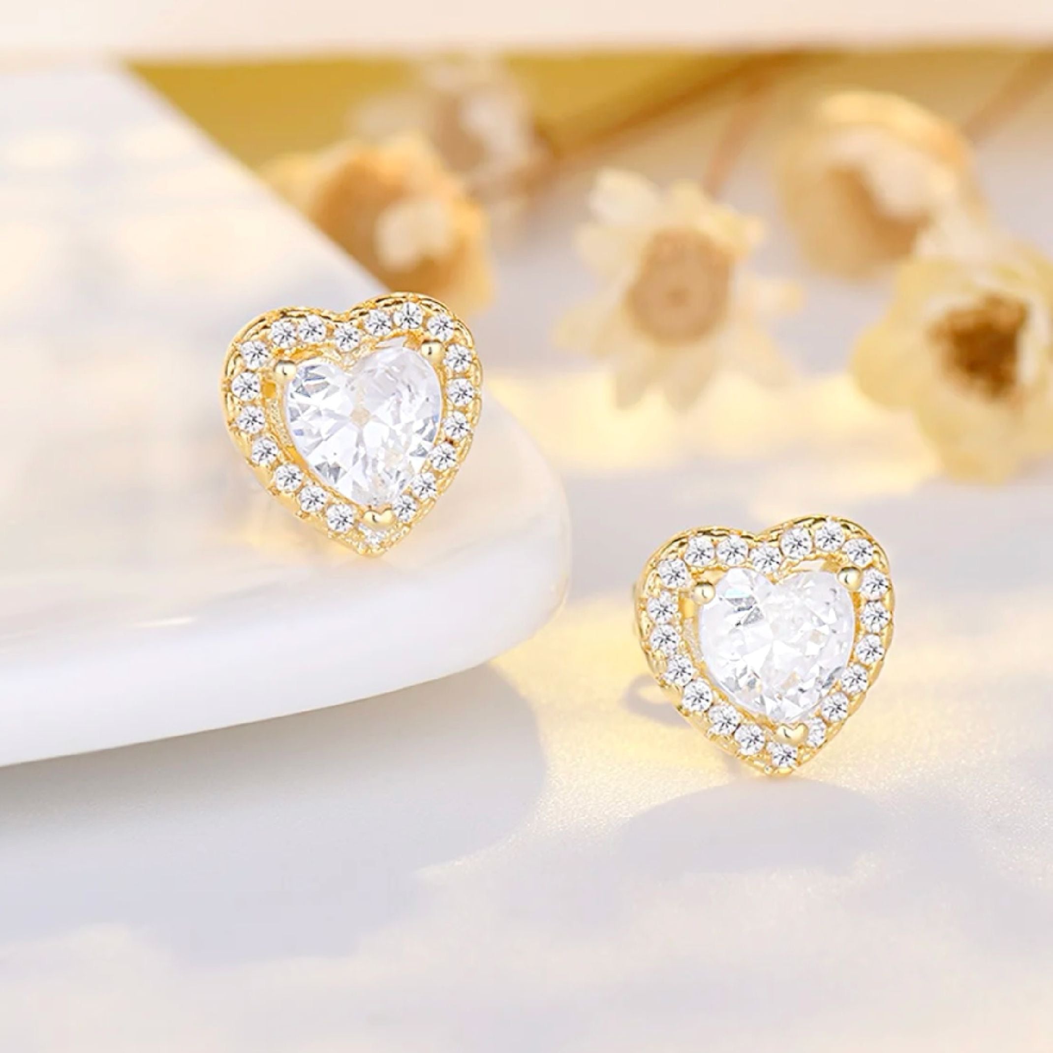 Gold heart stud earrings