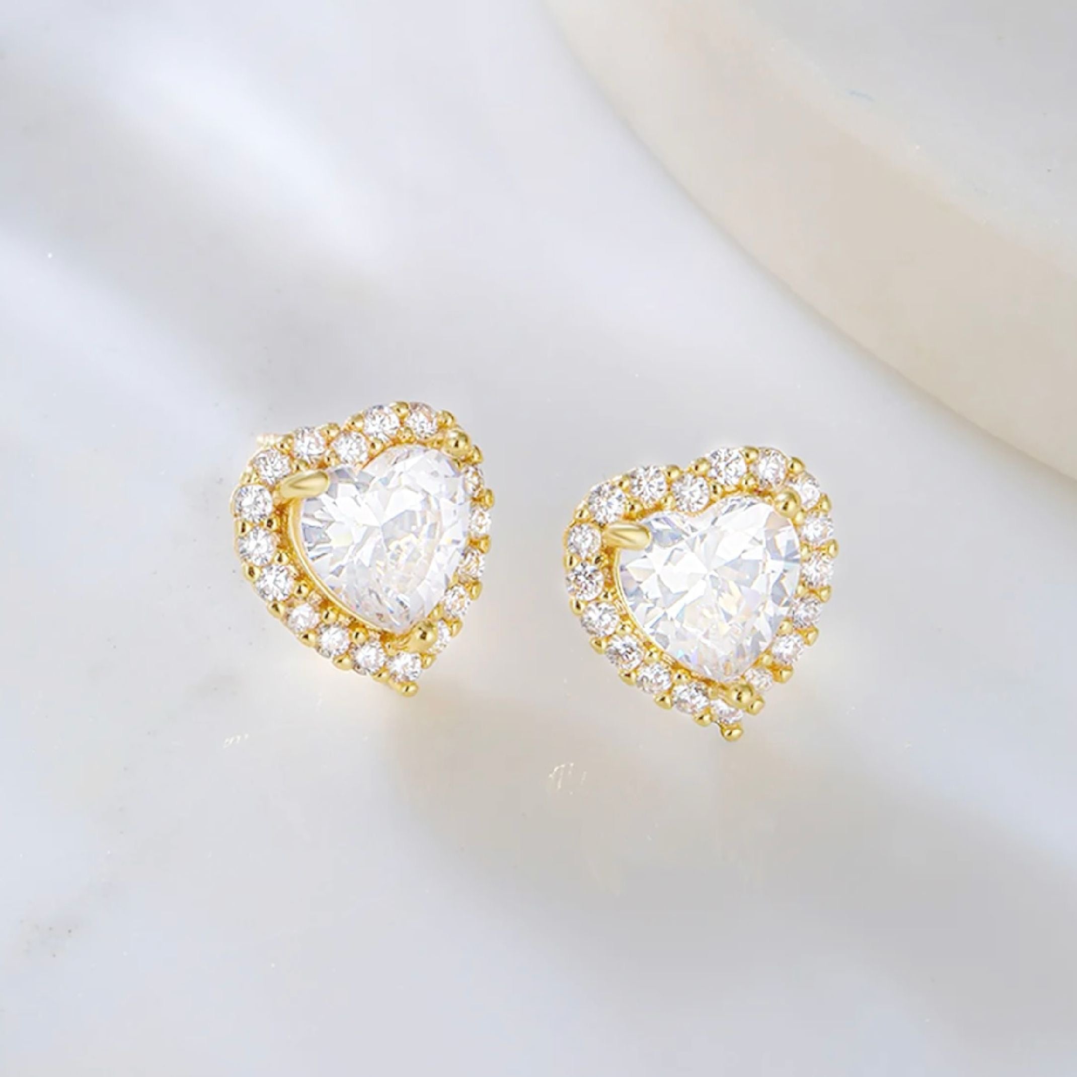 Gold heart stud earrings