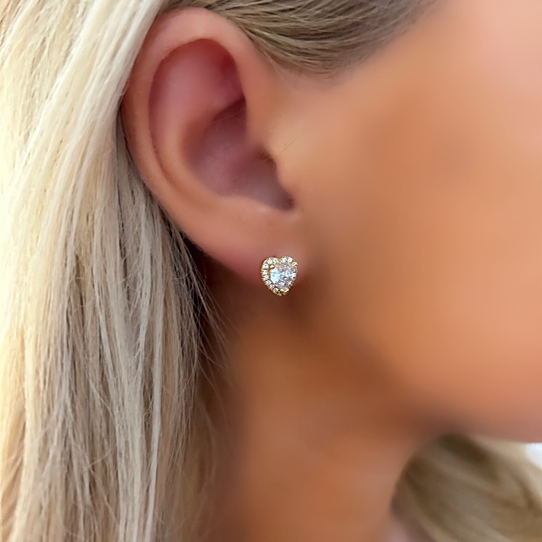 Gold heart stud earrings