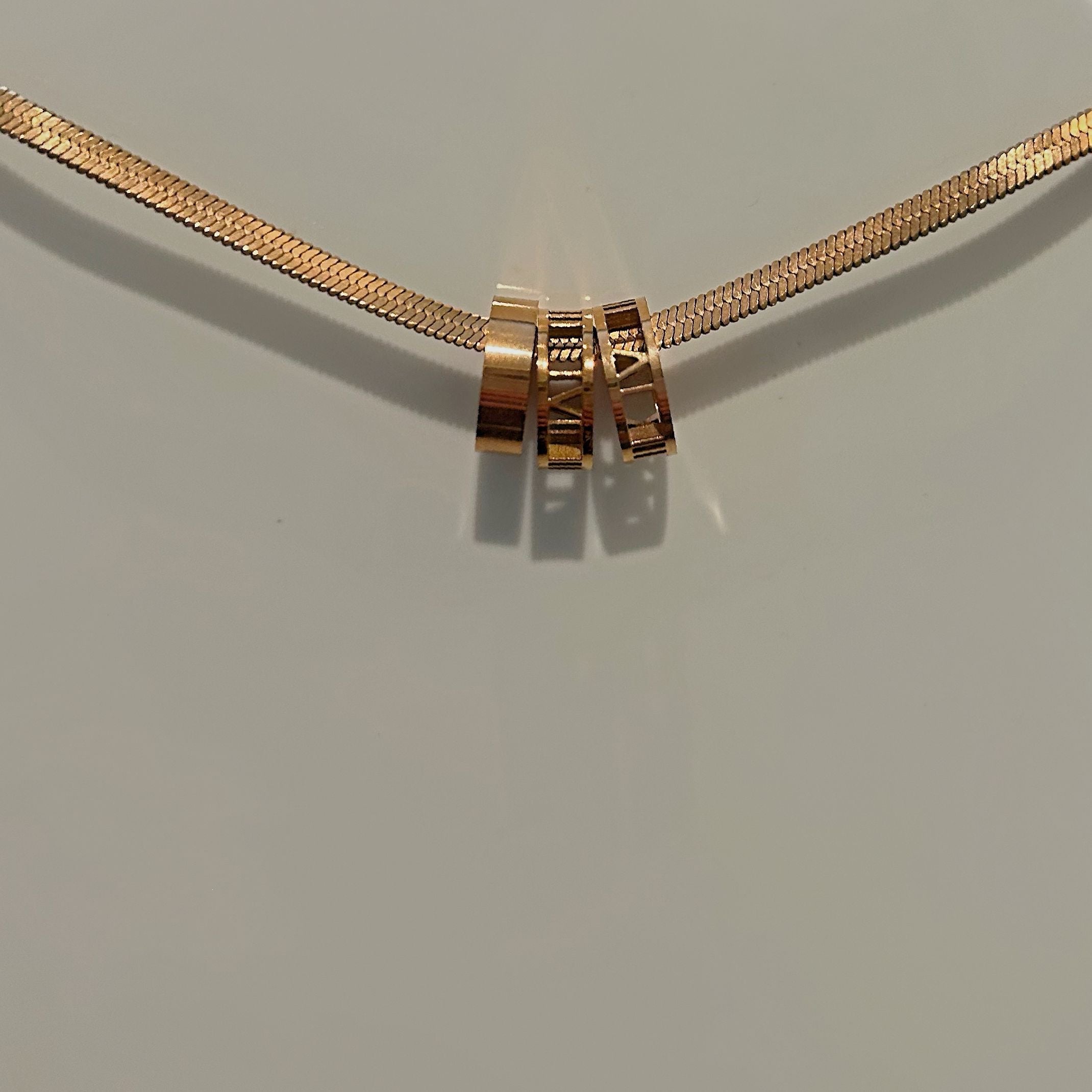Rose gold Roman snakeskin necklace