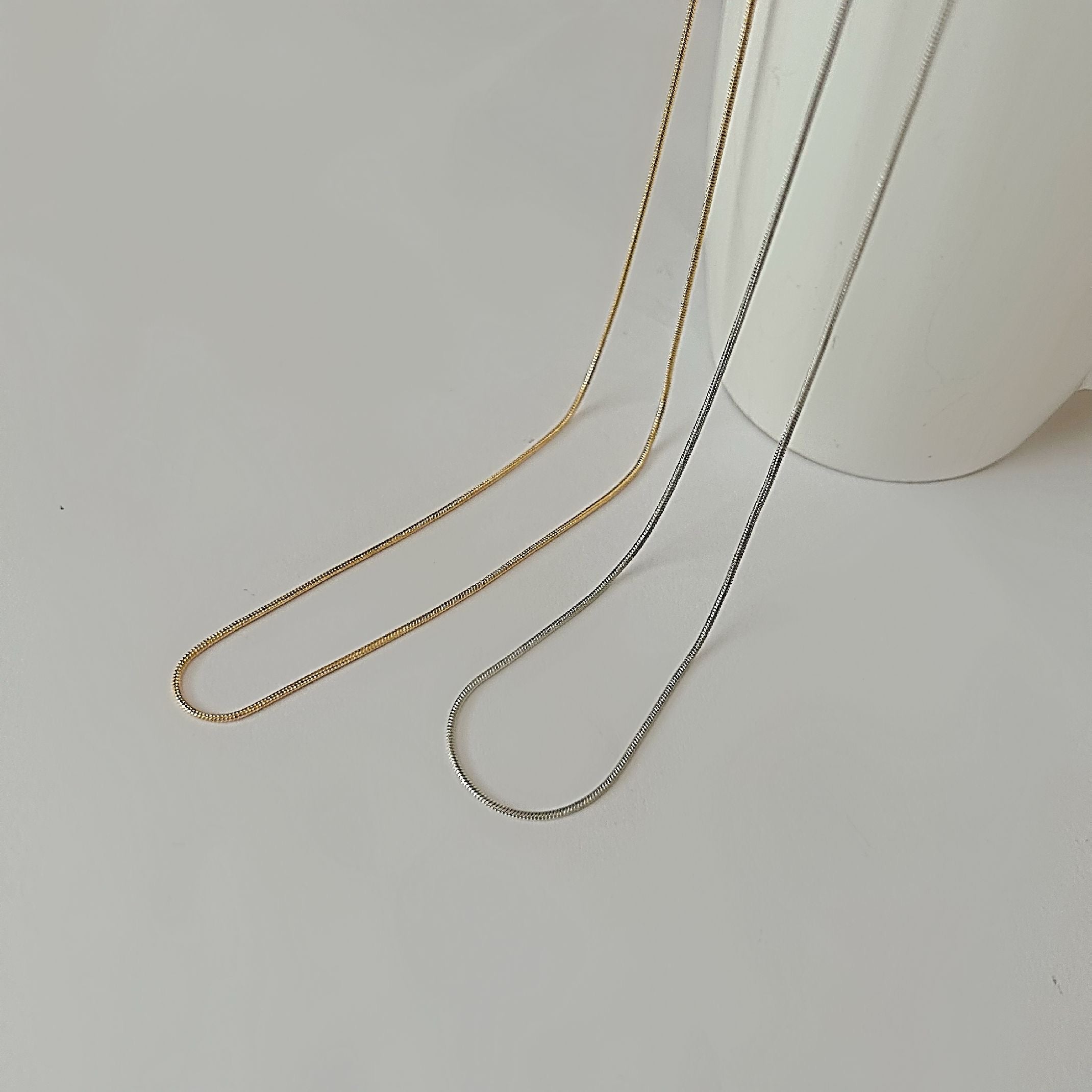 Dainty silver and gold chains