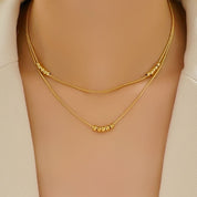 Gold bead layered necklace