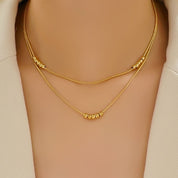 Gold bead layered necklace 