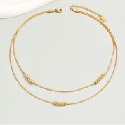 Gold bead layered necklace
