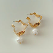 Gold hoop earrings with pearl