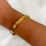Gold evil eye bangle