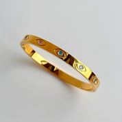 Gold evil eye bangle
