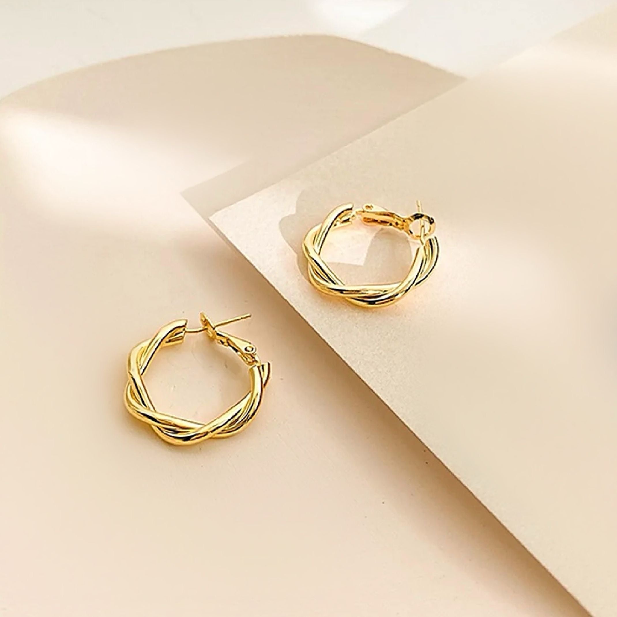 Gold twirl hoop earrings 
