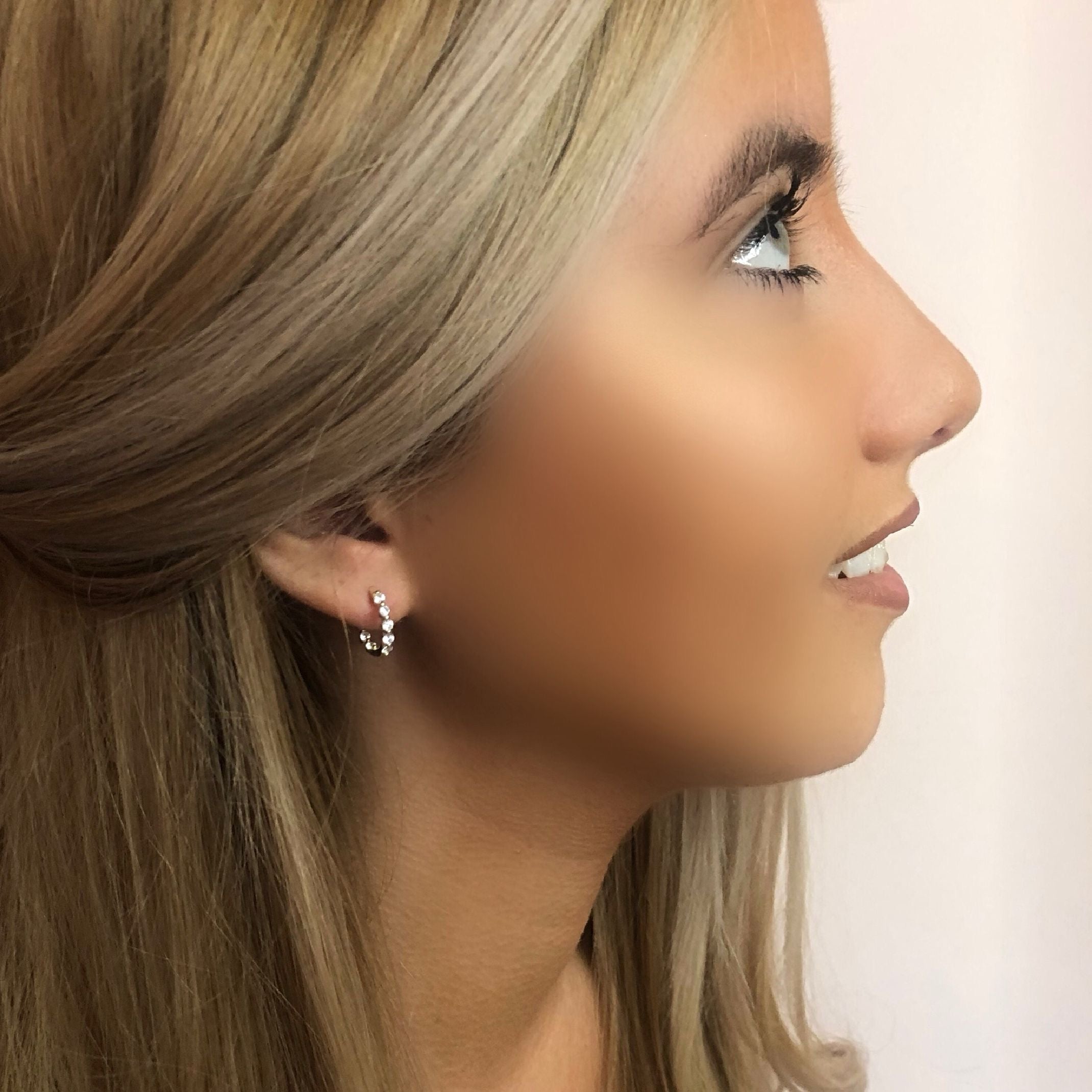 Gold crystal huggie earrings