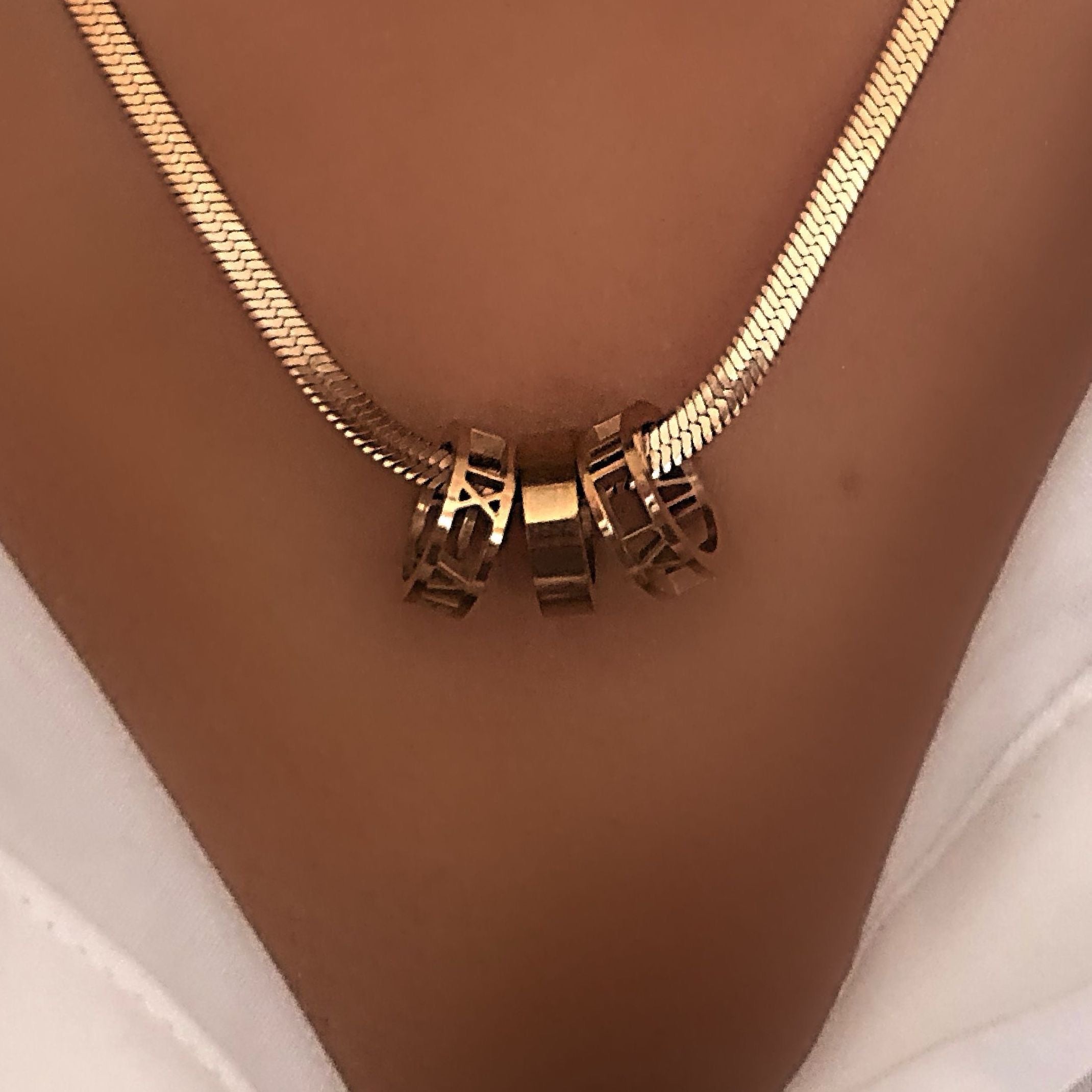 Rose gold snakeskin love ring necklace