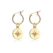 Gold star disc earrings 