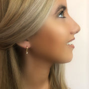 Gold dangling diamond earrings