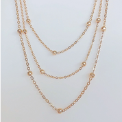 Gold bead layered necklace 