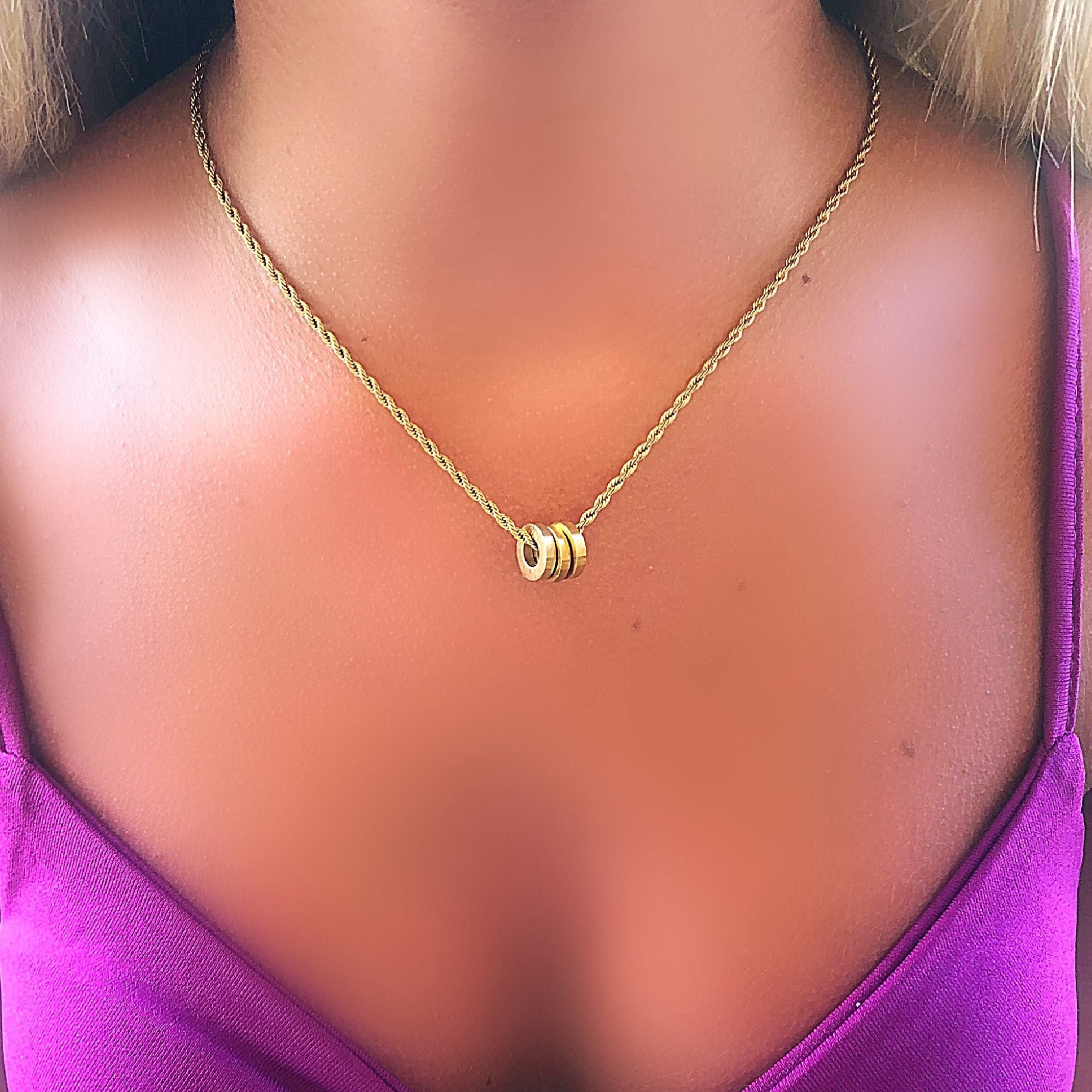 Gold triple ring necklace 
