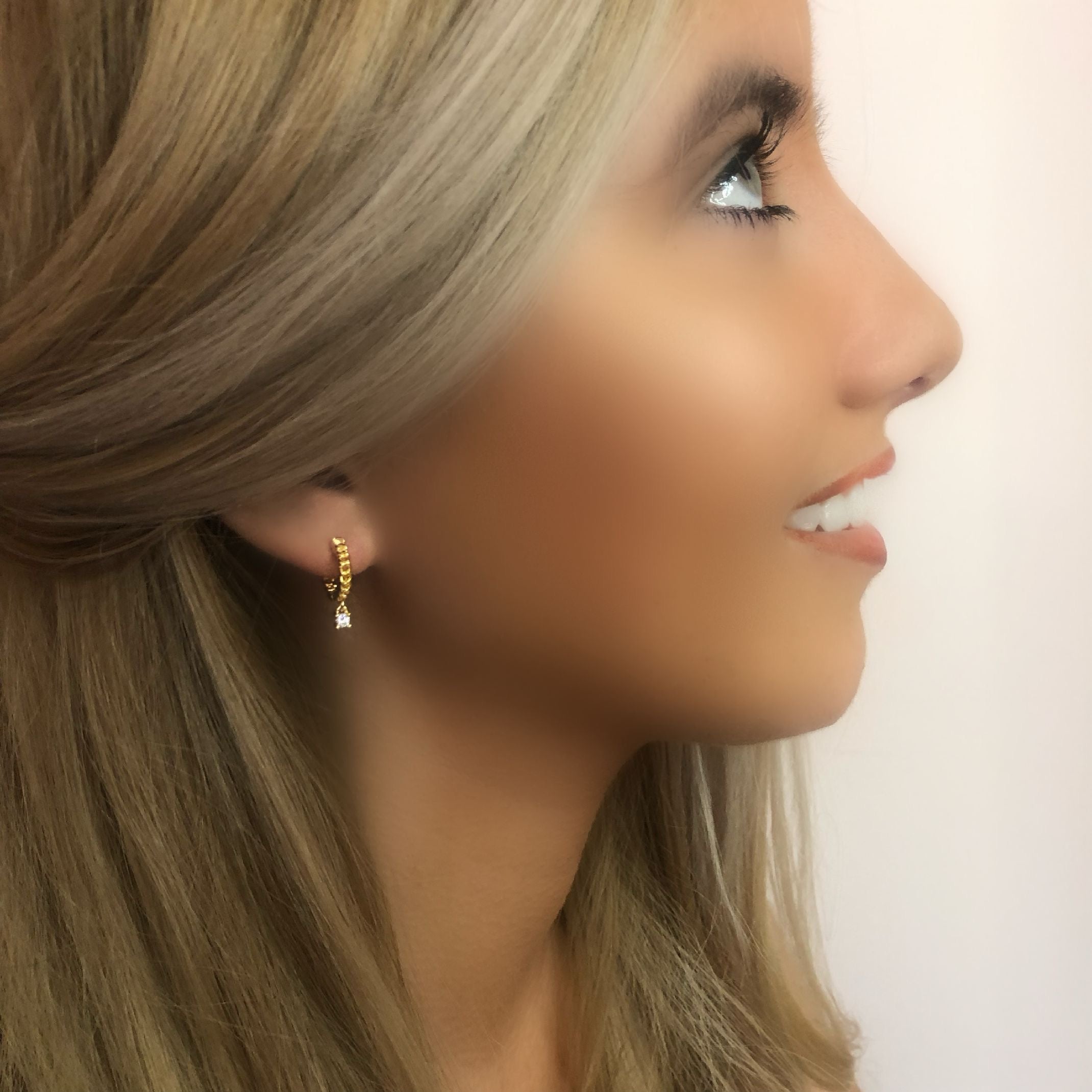 Gold diamond huggie earrings 