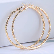 Large gold textured hoop earrings