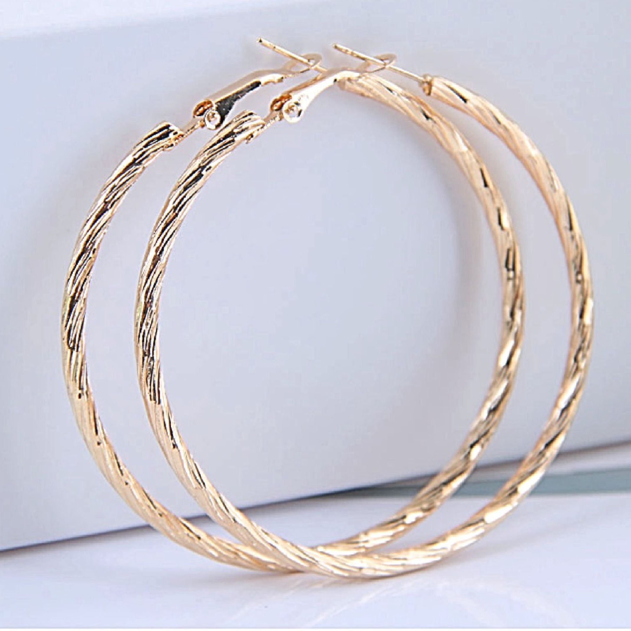Large gold textured hoop earrings