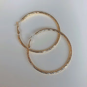 Large gold textured hoop earrings