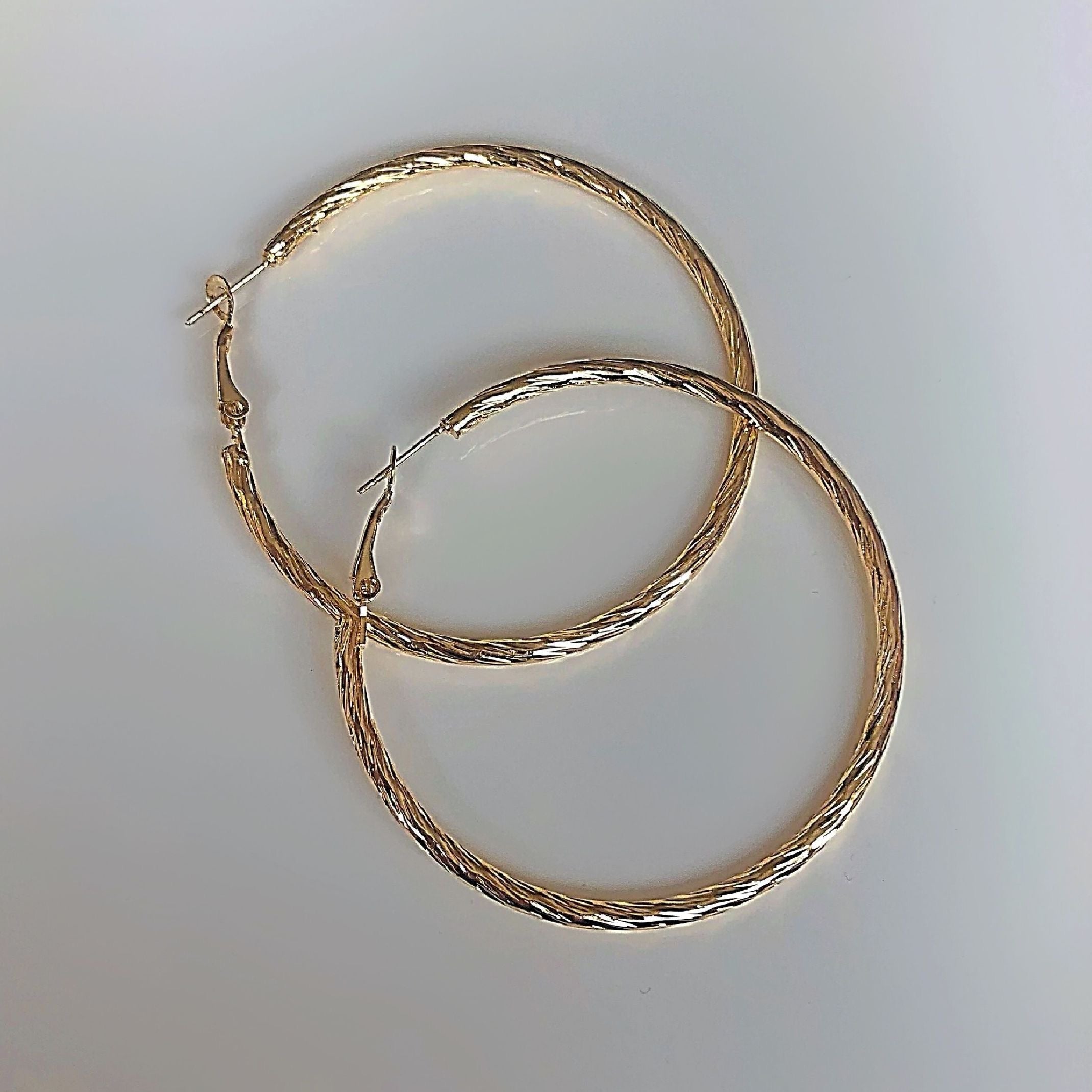 Large gold textured hoop earrings