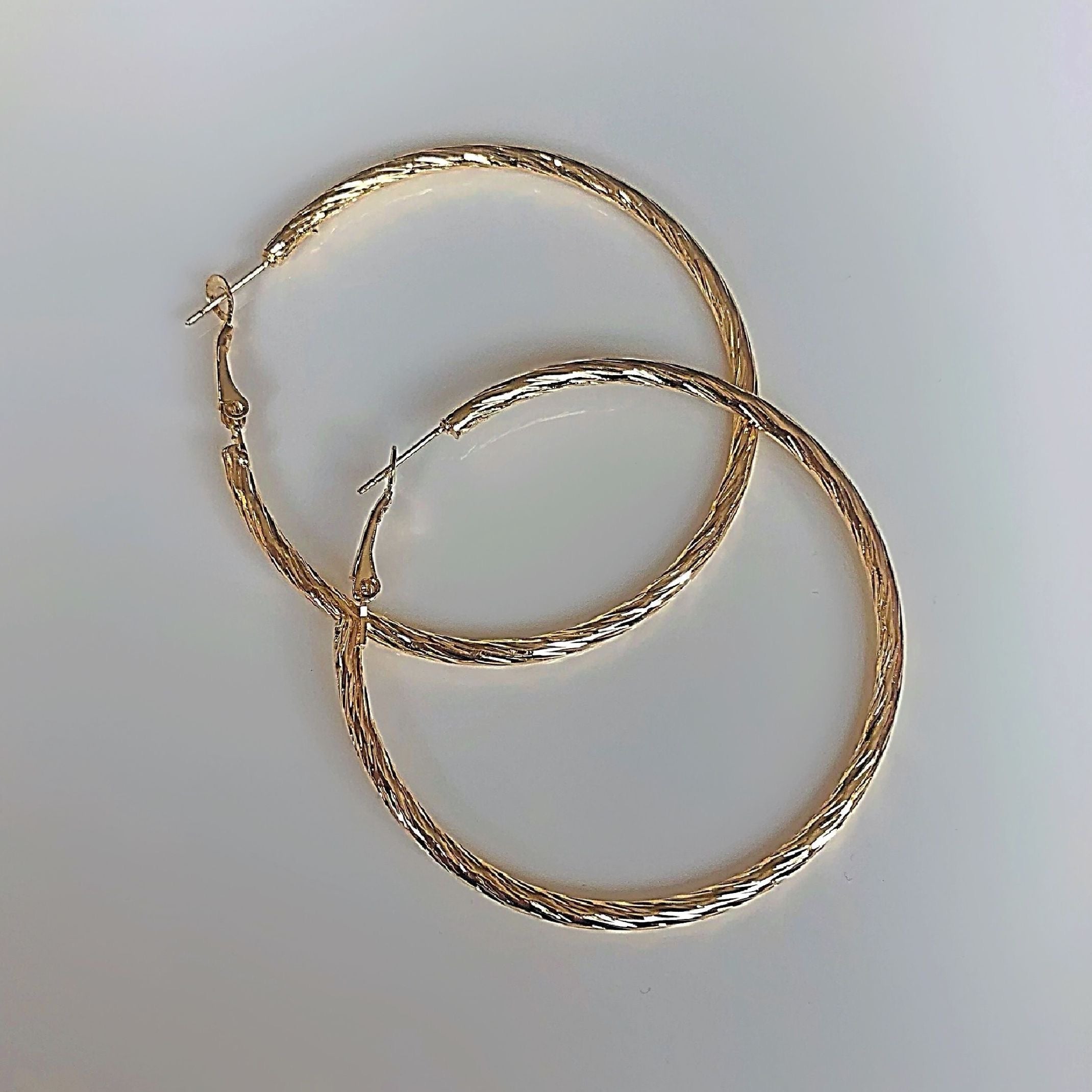 Large gold textured hoop earrings 