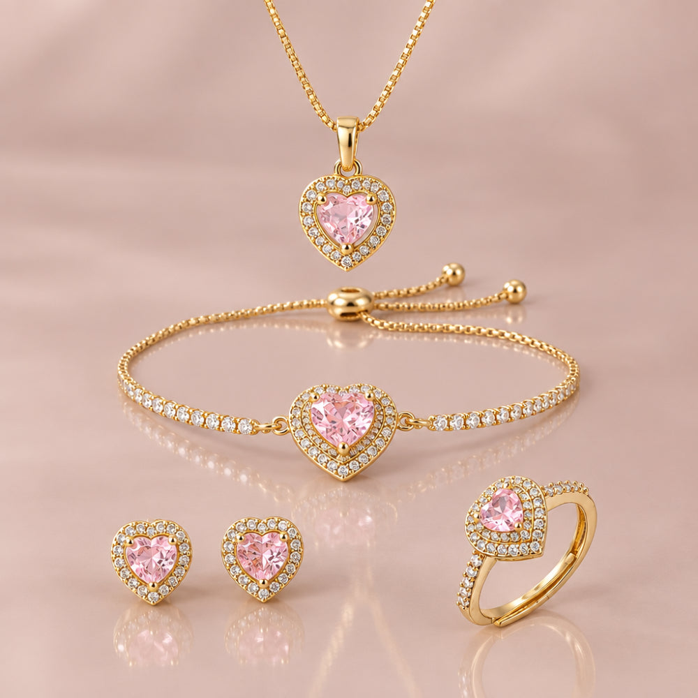 Gold tone pink heat pendant necklace, toggle bracelet, stud earrings and adjustable ring with sparkling cubic zirconia details
