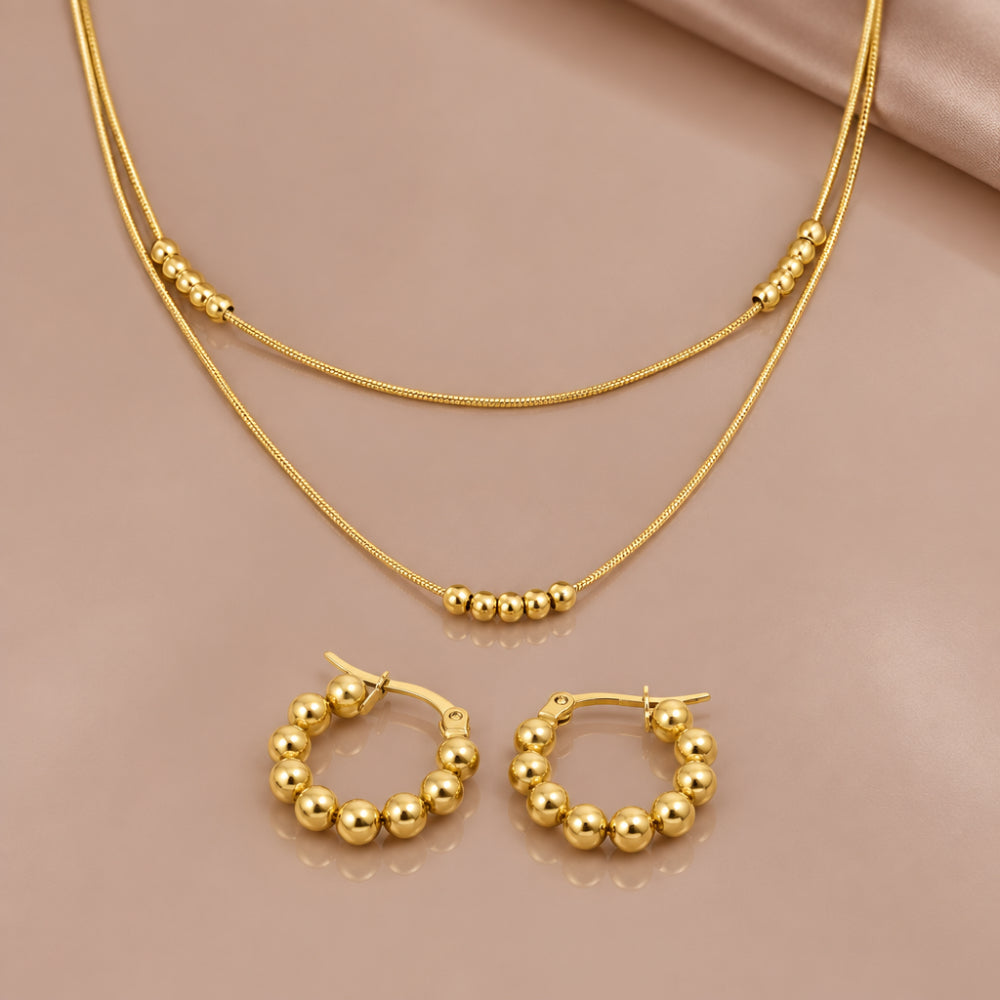 Gold layered bead necklace with matching bead huggie hoop earrings