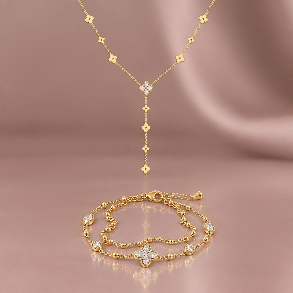 Gold plated clover y necklace and matching double chain bracelet with sparkling cubic zirconia four leaf clover details 