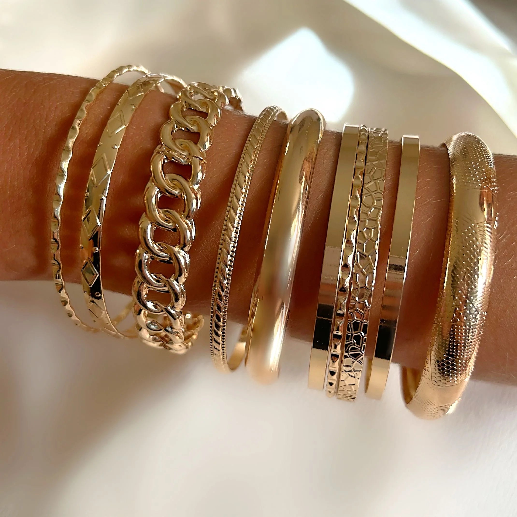 Gold bangle stack 