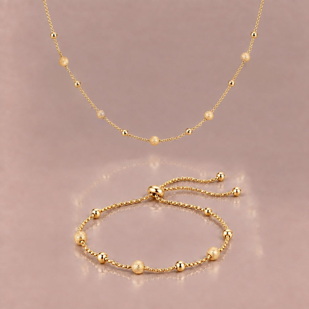Gold plated beaded necklace and matching bracelet with alternating glossy and matte glitter-finish beds 