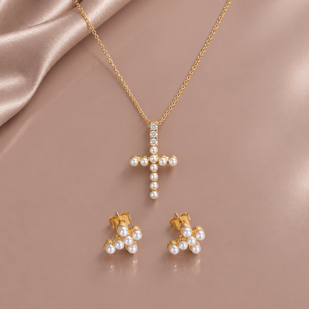 Gold cross pendant necklace and pearl detail cross stud earrings