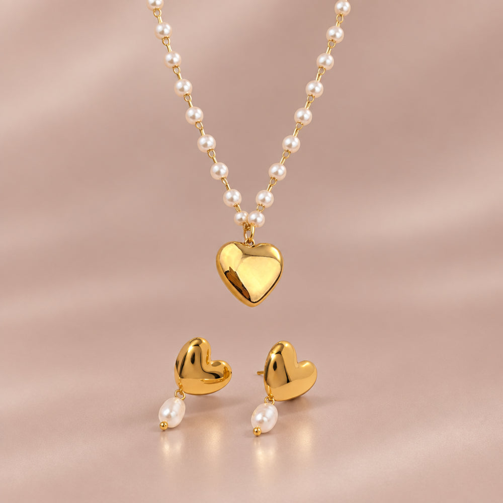 Gold heart necklace with white pearl details and matching pearl drop earrings 