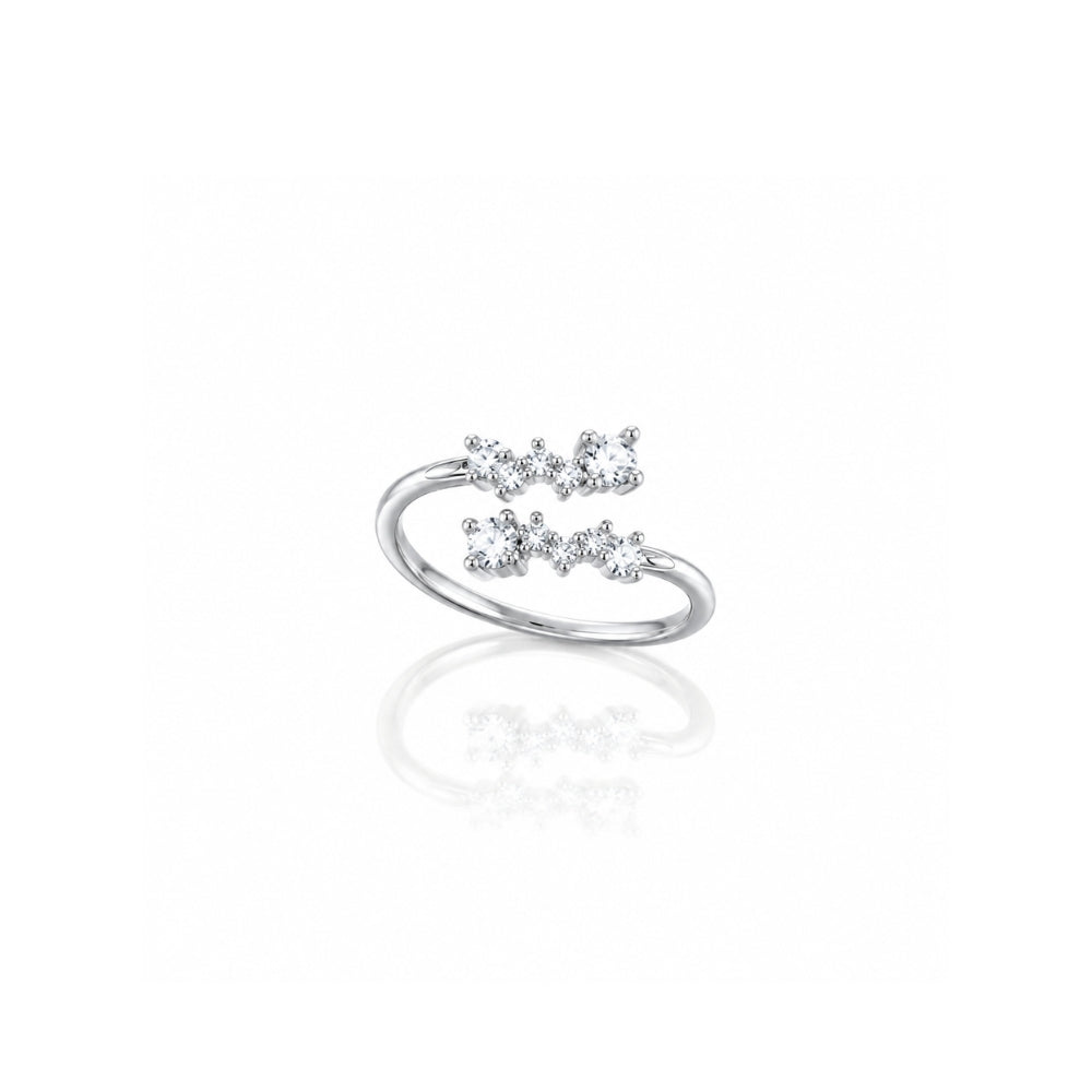  silver ring with three small clear gemstones arranged in a bow-like cluster On a clea white background 