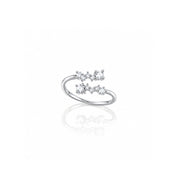  silver ring with three small clear gemstones arranged in a bow-like cluster On a clea white background 