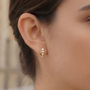 Dainty gold hoop earrings with crystals 