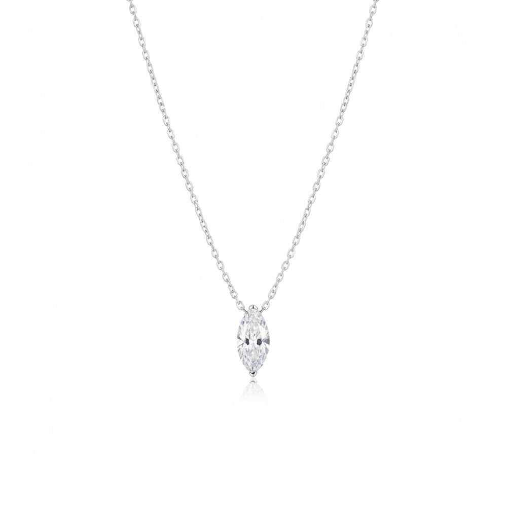 A delicate silver chain necklace featuring a marquise-cut diamond pendant, shown against a solid white background.