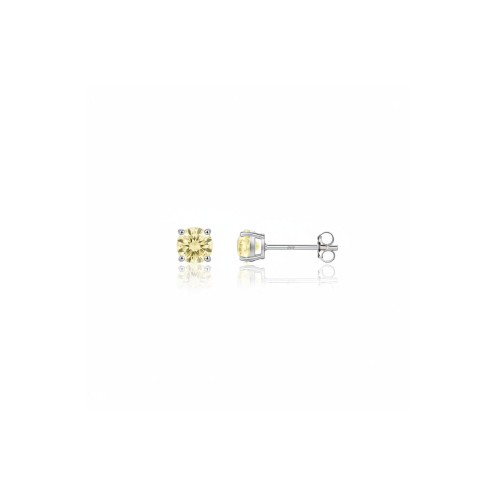 A pair of yellow diamond stud earrings in silver settings, shown from the front and side on a reflective white background.