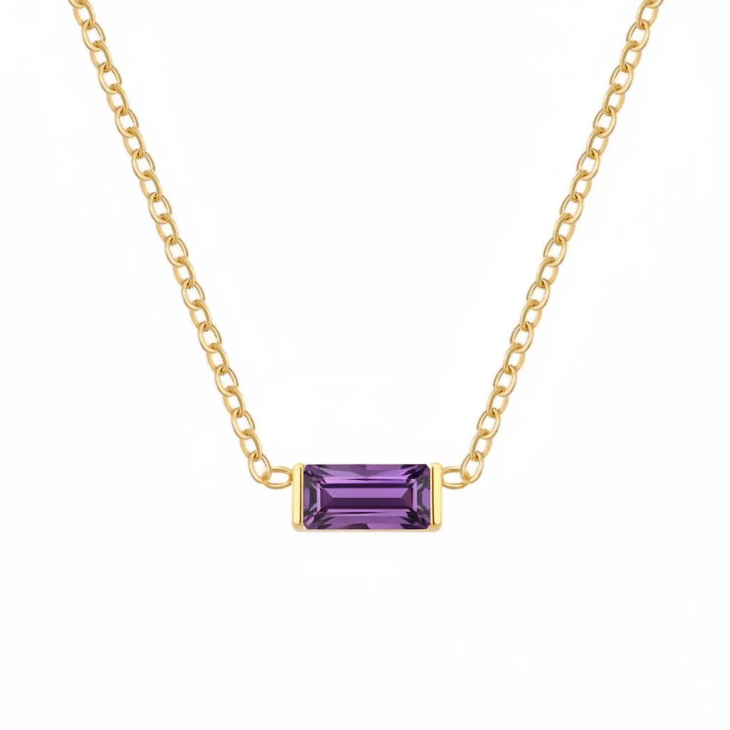 A delicate gold chain necklace featuring a rectangular emerald-cut purple gemstone pendant, displayed against a solid white background.