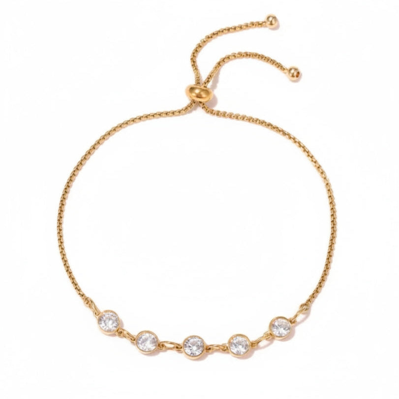 Five Stone Crystal Bezel Bracelet in silver worn on a wrist, close-up detail of the CZ bezel stations and adjustable bolo closure