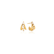 A pair of gold crescent-shaped hoop earrings with a vertical row of clear round-cut stones, displayed on a clean white background with a soft reflection.