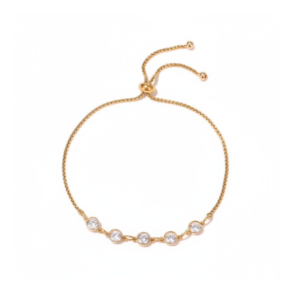 A delicate gold chain bracelet with five clear round-cut stones set in a row, featuring an adjustable sliding clasp, shown on a plain white background.