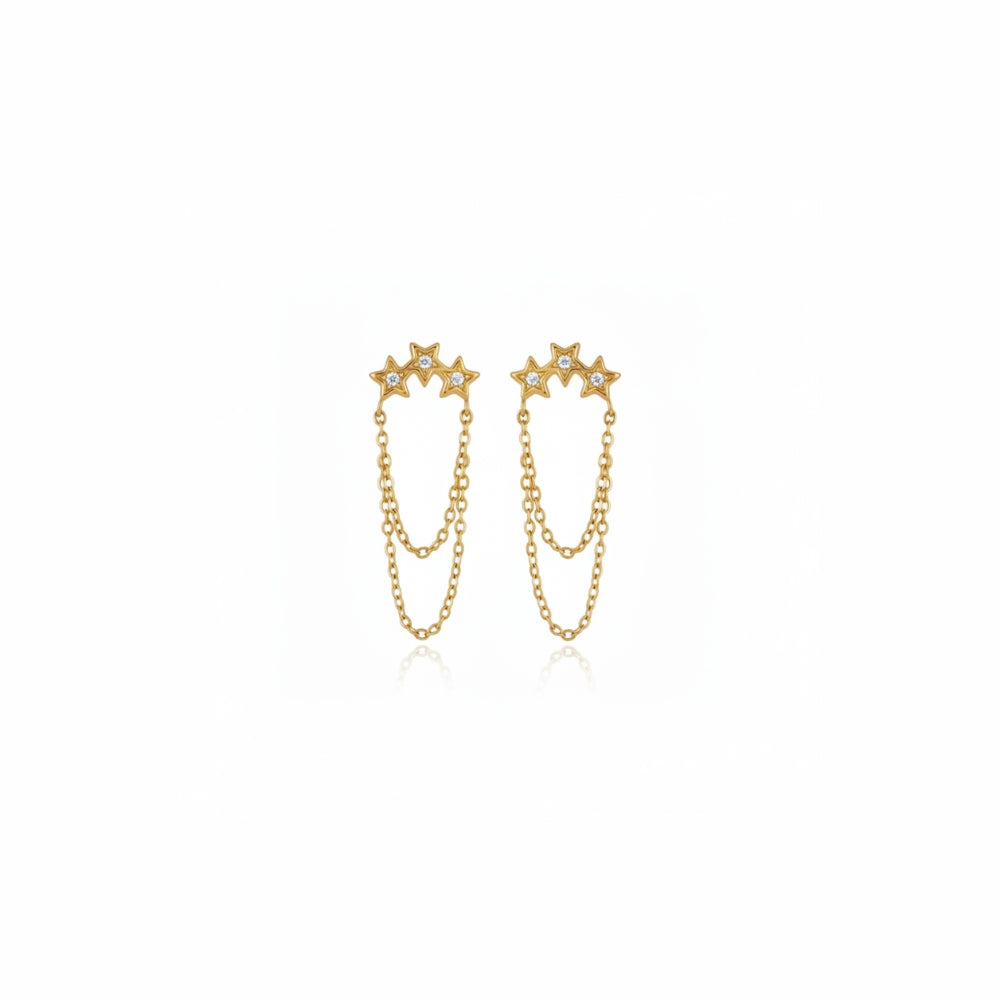 A pair of gold dangle earrings featuring three star-shaped studs connected by delicate chains, shown on a plain white background.