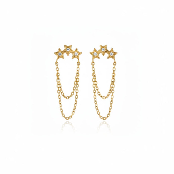 A pair of gold dangle earrings featuring three star-shaped studs connected by delicate chains, shown on a plain white background.